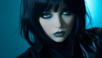 Mysterious woman with intense gaze and blue lighting photo