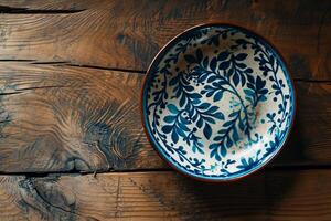 Traditional ceramic plate on a rustic wooden table photo