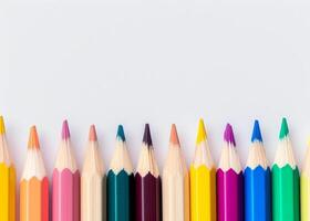 Colorful pencils lined up on a white background photo