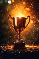 Golden trophy cup on sparkling background photo