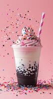 Colorful Sprinkles Falling onto Whipped Cream Topped Milkshake photo