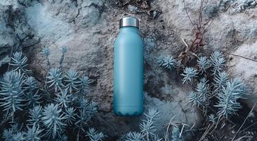 Reusable water bottle in a natural outdoor setting photo