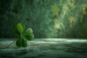 Four leaf clover on a textured surface with a green blurred background photo
