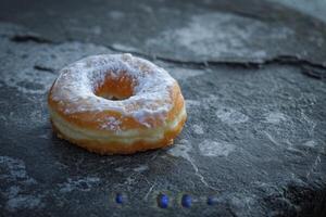 Fresh Sugared Donut on a Rustic Surface photo