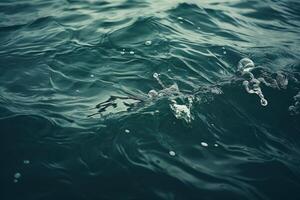 Serene Water Surface with Gentle Waves and Bubbles photo