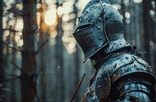 Medieval knight in armor standing in a misty forest photo