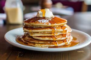 Stack of Pancakes with Syrup and Butter on Top photo