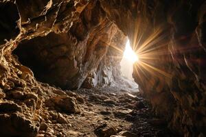 sun shining through a cave photo