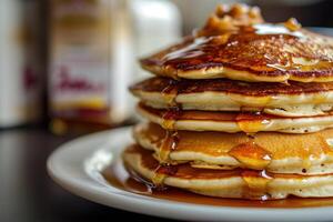 a stack of pancakes with syrup on top photo