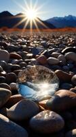 a close up of a glass object on a rocky beach photo