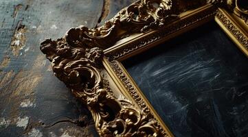 a gold frame on a wooden surface photo
