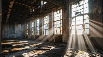 sunlight shining through windows in an abandoned building photo