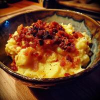 a bowl of mashed potatoes with bacon photo
