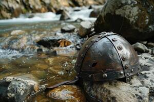 a helmet on a rock photo
