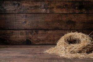 Rustic wooden background with straw pile photo