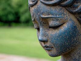 close up of a weathered bronze buddha statue photo
