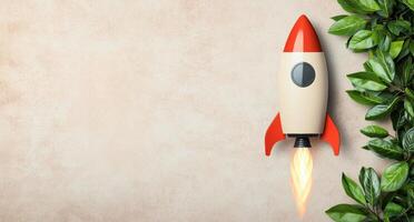 Rocket launch startup business concept with green leaves photo