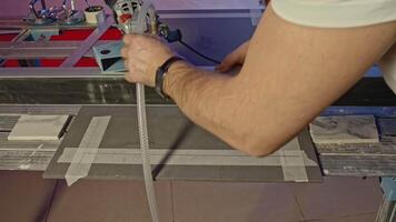 Using circular saw to cut board at the workshop. Creative. Industrial background with professional equipment. video