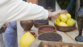 The vibrant and colorful market display showcases a variety of aromatic spices and fresh fruits. Action video