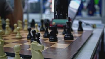 Man is playing chess with robot. Media. Man is playing chess against robot at exhibition. Artificial intelligence technologies versus humans video