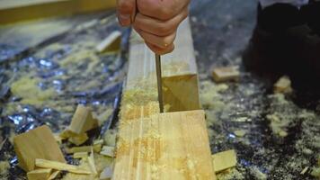 Carpenter using chisel tool for wood working. Media. Carpentry, craftsmanship, handicrafts concept. video