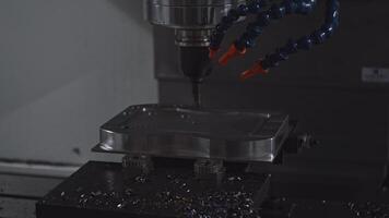 Automated drill on industrial machine. Media. Robotic machine with drill to drill holes in metal. Machine with drill rotates and holes metal plates video