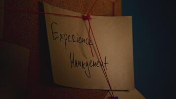Lantern illuminates notes on board. Stock footage. Notes with words on blackboard in night office. Quest with rebus on notes with strings video
