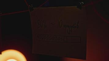 Mysterious notes in night office. Stock footage. Rebus notes are illuminated in night office. Mysterious notes with inscriptions and red thread in night room video