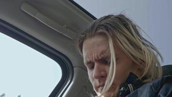 Close-up of young man sitting nervously in car. Stock. Man with panic attack is sitting in car. Man is stressed and nervous while driving car video