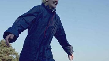 Young man runs and falls off cliff. Stock. Man runs on stone ledge and falls into cliff in forest. Man falls from stone cliff in forest with run video