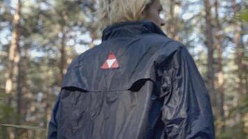 Man walks through forest and finds something. Stock. Young man comes out of woods and finds man. Man lost in forest finds way out video