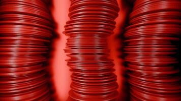 Abstract rows of red round discs slowly moving like snakes. Design. 3D columns of flat round discs. video