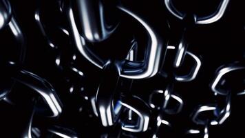 Abstract industrial background with metal large glossy chains hanging isolated on a black background. Design. Silver chains slowly rotating. video