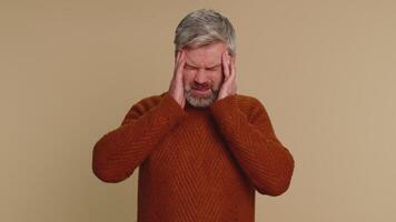 Man rubbing temples to cure headache problem, suffering from tension and migaine, stress, pain video