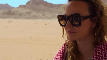 A woman residing in a vast desert embracing adventure and exploring lifes beauty. Action video