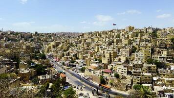 A panoramic view of a vibrant cityscape with rolling hills and unique architecture. Action video