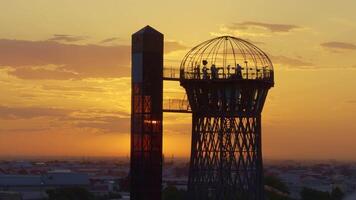 A Stunning Sunset Scene Over the Modern Observation Tower Captivates All Who Pass By. Action video