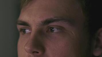 Man looks at computer screen and wins. Clip. Man successfully created the code or won computer game. Gamer or programmer is happy looking at computer screen video