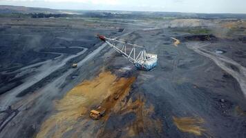 An Aerial View Capturing a Mining Site Complete with Heavy Machinery Operating Below. Stock Clip video