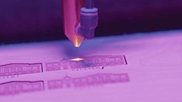 Close-up of laser printer engraving patterns. Media. Dot laser engraves patterns in robotic printer. Laser printers for fine engraving on any material video