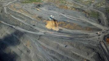 Aerial View of a Large Mining Site Featuring Heavy Machinery and Varied Terrain Landscape. Stock Clip video