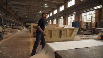 A skilled craftsman is diligently working in a woodworking workshop, creating beautiful pieces. Stock Clip video
