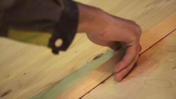 Dedicated Craftsman Engaged in Working with Various Types of Wood Inside His Workshop. Stock Clip video
