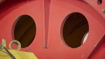 Detailed Close-Up View of Circular Portholes on a Vibrant Red Industrial Structure. Stock Clip video