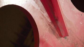 This is an abstract closeup image that showcases striking red and black curved shapes. Stock Clip video