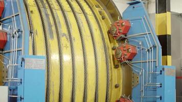 Industrial Equipment with a large yellow roller mechanism for diverse operations and functions. Stock Clip video