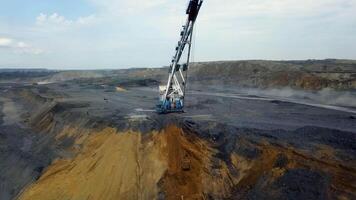 Aerial view showcasing heavy machinery working on an open pit mining operation in action. Stock Clip video