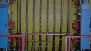 Mechanism with ropes for mines. Stock clip. Drum of winch of mine lifting system in production. Multiple ropes on drum for mine lifting system video