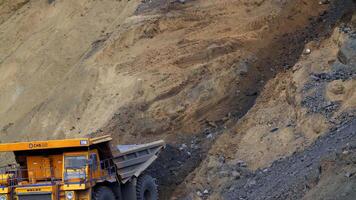 Heavy Duty Dump Truck working tirelessly on a Mining Site with various materials and resources. Stock Clip video