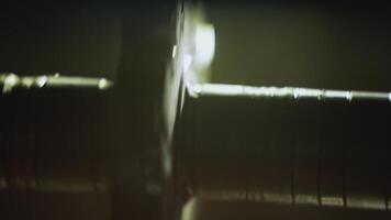 Close up of fast spinning gear on blurred background. Stock footage. Industrial background with moving mechanism. video